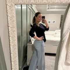 Customer wearing Sculpt Jeans in a casual home setting