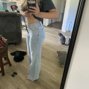 Customer wearing Vintage Blue Sculpt Jeans at home